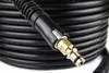 A close-up view of a coiled black hose with a brass connector. Podgląd zdjęcia produktu