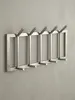 Wandgarderobe aus Metall, Elegante Kleiderhakenleiste mit Produktbild-Vorschau 1