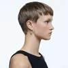A profile view of a woman wearing Swarovski hoop earrings. Produktbild-Vorschau