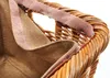 Close-up view of the interior and handle of a wicker basket. Produktbild-Vorschau