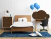 A child's bedroom with a bed, desk, and dresser. Produktbild-Vorschau