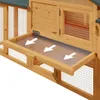 Close-up view of a wooden multi-story rabbit hutch with a pull-out tray and arrows indicating movement. Anteprima dell’immagine prodotto