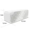 A white Bluetooth speaker with dimensions indicated by dashed lines and measurements. Anteprima dell’immagine prodotto
