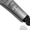 A close-up of a silver tube of Redken Hair Cleansing Cream Shampoo, with some product squeezed out at the bottom. Náhled obrázku produktu