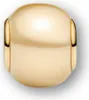 A close-up studio shot of a single gold charm. Podgląd zdjęcia produktu