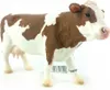 A toy cow figurine on a white background. Podgląd zdjęcia produktu