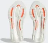 The soles of two white Adidas running shoes with orange accents are shown against a white background. Podgląd zdjęcia produktu