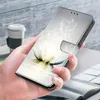 A hand holding a phone case with a lotus design. Produktbild-Vorschau