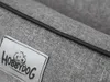 A close-up of a gray fabric dog bed with a label. Náhled obrázku produktu