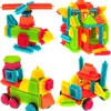 A collage of four different building block creations: a helicopter, a house, a train, and a car. Voir les images du produit