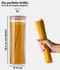 A glass jar filled with spaghetti is shown next to a hand holding a bundle of spaghetti. Dimensions and volume are indicated. Voir les images du produit