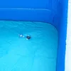 A close-up view of the inside of an inflatable swimming pool, showing the blue liner and a drain valve. Produktbild-Vorschau