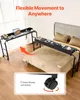 A mobile desk is shown next to a bed, with an arrow indicating movement. A close-up of a wheel is also shown. Anteprima dell’immagine prodotto