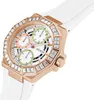 A close-up, angled view of a women's watch with a white band and a rose gold-toned bezel adorned with clear stones. Náhľad obrázku produktu