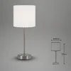 A table lamp with a white shade and a silver base and stem, shown against a plain gray background. A diagram with dimensions is shown to the right. Produktbild-Vorschau