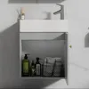 A gray bathroom vanity with a white ceramic sink and a faucet, with the cabinet door open to reveal toiletries and towels. Podgląd zdjęcia produktu
