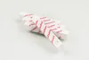 Several pieces of white chalk with red lettering are arranged in a criss-cross pattern on a white surface. Anteprima dell’immagine prodotto