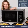 A woman is posing with a black microwave oven, with food dishes in the foreground. Produktbild-Vorschau