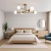 A bedroom scene with a bed, nightstands, a dresser, a chair, and a ceiling light fixture. Náhľad obrázku produktu