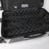 An open black suitcase with a patterned interior. Produktbild-Vorschau