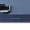 Close-up of a dark blue phone case, showing the edge and a button. Voir les images du produit