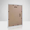 The back of a white picture frame is shown against a light gray and white background. Anteprima dell’immagine prodotto
