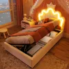 A child's bedroom with a bed that has storage, a bedside table, and a window view. Produktbild-Vorschau