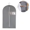 A grey garment bag is shown hanging on a hook. A smaller inset image shows a person placing a garment inside a similar bag. Produktbild-Vorschau