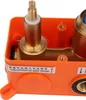 Close-up view of the internal components of a shower system, mounted in an orange plastic housing. Náhled obrázku produktu