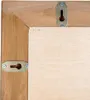 Close-up view of the back of a wooden framed mirror, showing mounting hardware. Produktbild-Vorschau