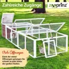 An outdoor rabbit hutch with multiple openings, set on a grassy lawn with trees in the background. Produktbild-Vorschau