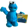 A blue plush toy of Cookie Monster from Sesame Street is shown against a white background. A tag is attached to its right arm. Produktbild-Vorschau