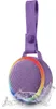 A purple Bluetooth speaker with a rainbow light ring, shown with water splashing around it. Produktbild-Vorschau