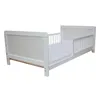 A white toddler bed with a mattress is shown from a side angle against a white background. Produktbild-Vorschau