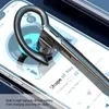 A close-up of a Bluetooth earbud resting on a smartphone screen displaying music. Náhľad obrázku produktu