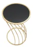 A round black table with a gold base is shown against a white background. Anteprima dell’immagine prodotto