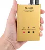 A hand holding a small gold electronic device. Produktbild-Vorschau