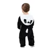 A baby wearing a panda costume, viewed from the back. Produktbild-Vorschau