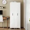 A white cabinet with two doors stands in a room next to a wooden desk and chair. Produktbild-Vorschau