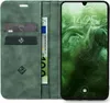 A green flip-style phone case with card slots and a phone inside. Produktbild-Vorschau