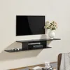 A black wall-mounted TV shelf with a TV, a game controller, and a media box. Podgląd zdjęcia produktu