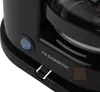 A close-up view of the control panel of a black Dometic coffee maker. Produktbild-Vorschau
