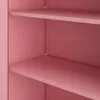 Close-up view of the interior of a pink metal cabinet with shelves. Produktbild-Vorschau