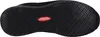 The image shows the sole of a black shoe with a textured grip pattern. A red oval label with white text is visible in the center. Voir les images du produit