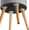 The underside of a stool with four wooden legs attached to a grey upholstered seat. Podgląd zdjęcia produktu