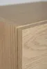 A close-up view of the corner of a wooden cabinet. Náhled obrázku produktu