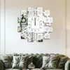 A decorative wall clock with photo frames is mounted on a wall above a plush sofa. Anteprima dell’immagine prodotto