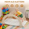 A toddler plays on a wooden climbing arch with a mat, surrounded by colorful building blocks and toys. Podgląd zdjęcia produktu