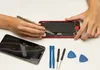 Hands are repairing a smartphone with tools laid out on a white surface. Produktbild-Vorschau