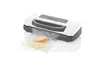 A white and gray vacuum sealer with a plastic bag containing food items. Náhľad obrázku produktu